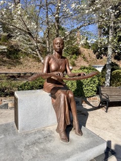 Nina Simone bronze statue blooming dogwood trees Tryon NC